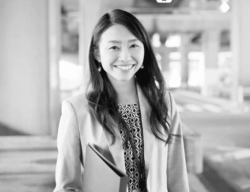 Confident businesswoman in professional attire representing cross-cultural communication success