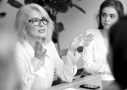 Leader explaining ideas to colleagues during a collaborative team meeting